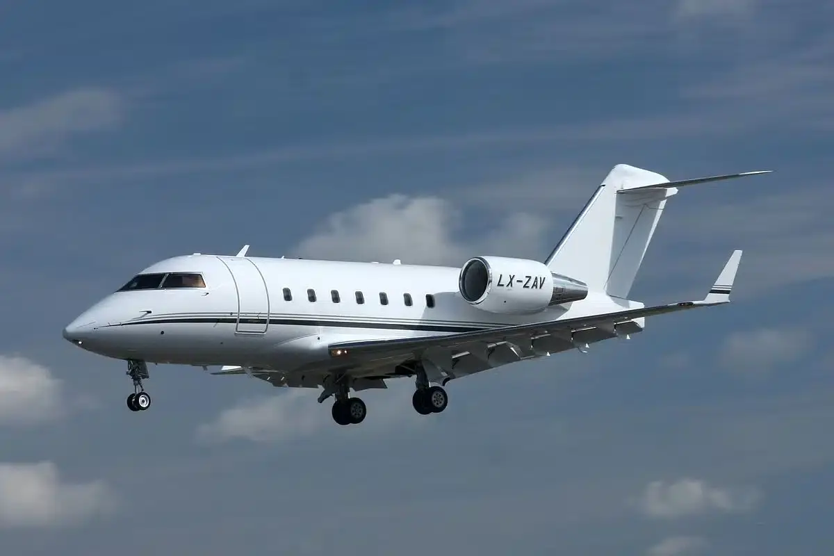 Challenger 600 heavy jet private charter — wide walk-around cabin with individual club seats and full galley