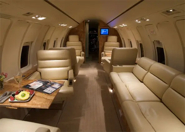 Challenger 600 full galley and private lavatory — heavy jet private charter amenities