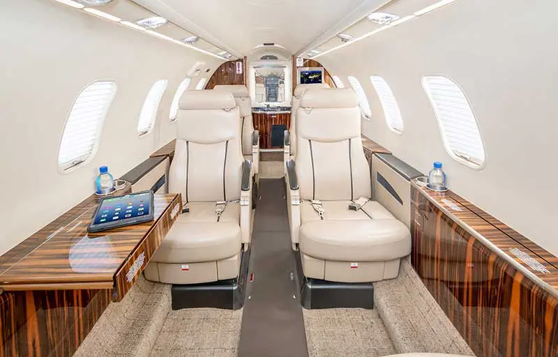 Luxury private jet cabin interior — empty leg charter with full service crew