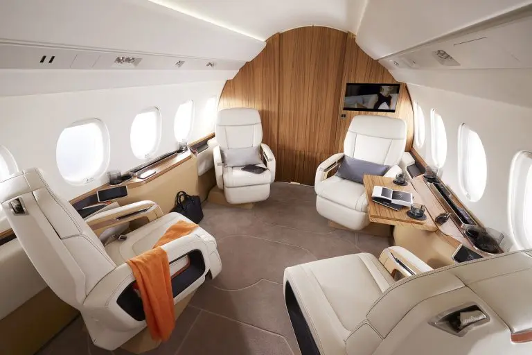 Dassault Falcon 6X heavy private jet — ultra-wide and tall cabin interior for 12 to 16 passengers with 5,500 nm intercontinental range