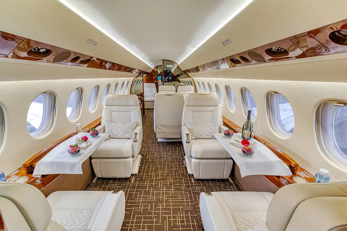 Falcon 7X cabin interior — luxurious ultra-long-range heavy jet cabin with stand-up headroom and flat floor for 12 to 16 passengers